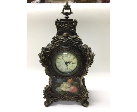 A reproduction clock together with a collection of lead jockeys on horseback.