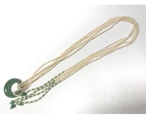 A long jade and fresh water pearl necklace.