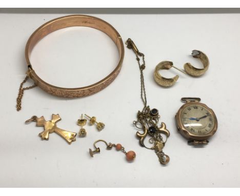 A small group of gold jewellery including a 9ct bangle and Edwardian necklace