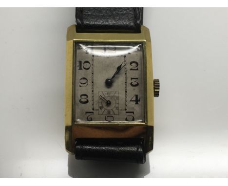 A gold plated wristwatch the square dial with Arabic numerals second subsidiary dial manual wind