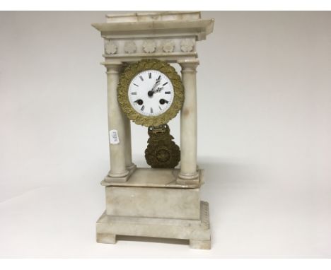 A alabaster four pillar clock the enamel dial with Roman numerals with visible sunburst pendulum