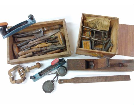 A collection of old tools including planes