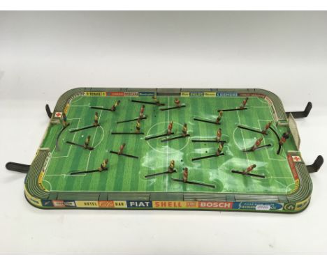 A boxed Hornby railway set and a vintage tin plate football game (2).