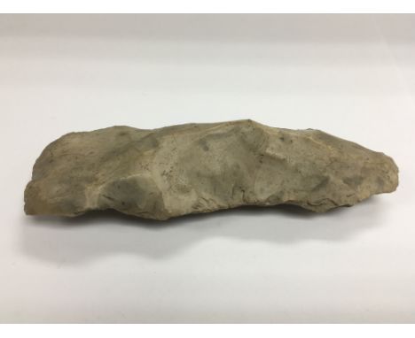 A piece of flint, possibly for use as an axe head.