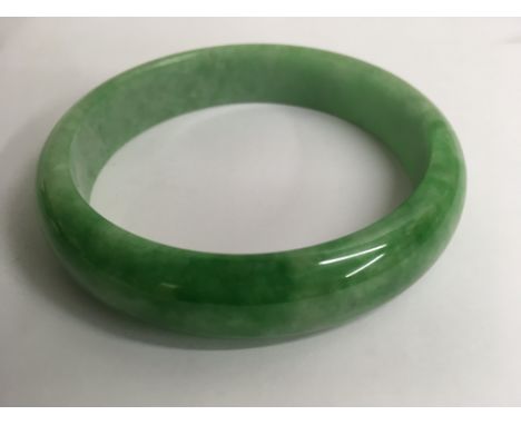 A spinach green jade bangle
