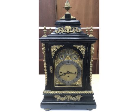 A fine quality, large Victorian bracket clock of ebonised wood having gilt metal mounts and French style sunburst design to s