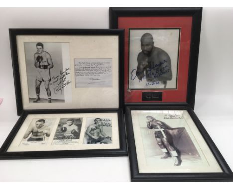 A box of signed prints, some with printed signatures.