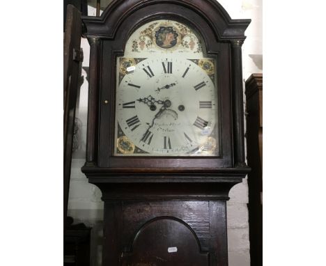A 8 day long case clock the arched painted dial with Roman numerals with weights and pendulum