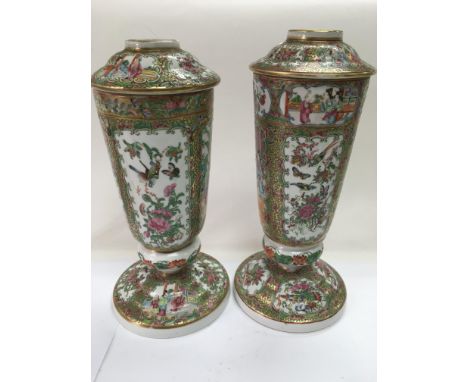 A pair of late 19th Century Cantonese lamp bases with hand painted decoration of figures in a garden setting and birds amongs