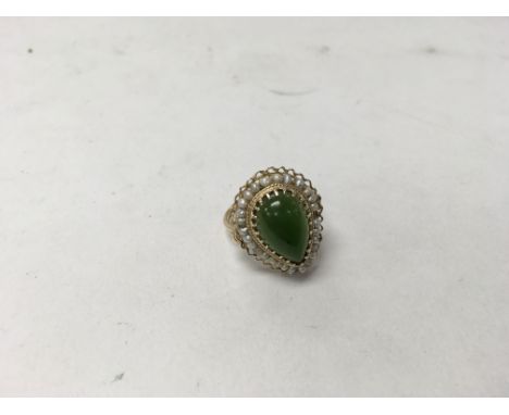 A jade and pearl ring. Weight approx 6g, size approx O