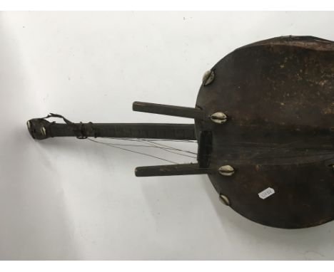 A Africa musical instrument inset with shells
