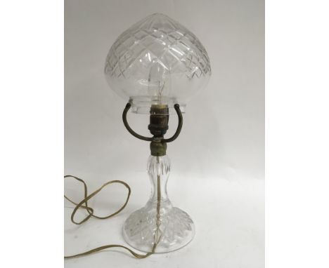 A cut glass table lamp with detached shade