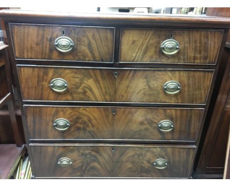 A Georgian mahogany chest of drawers the rectangular top above two short and three long drawers on bracket feet
