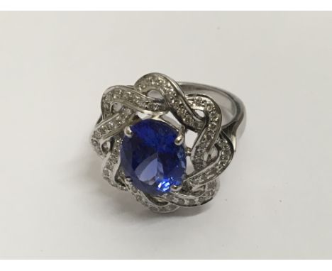 A tanzanite and diamond 14 ct white gold ring size O