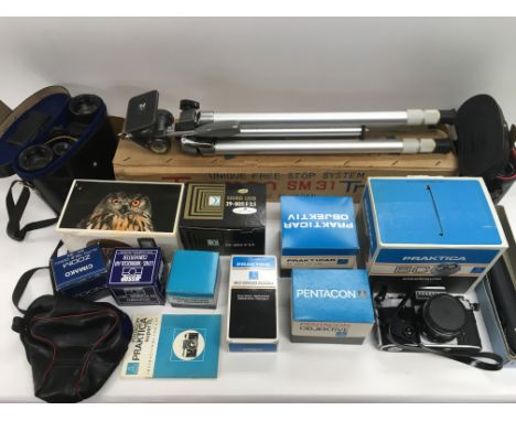 A box of cameras and a tripod stand.