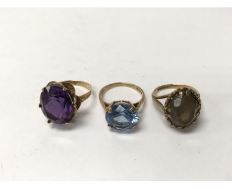 Three 9ct gold rings set with coloured stones. Weight approx 12.25g, sizes approx O, K & N.