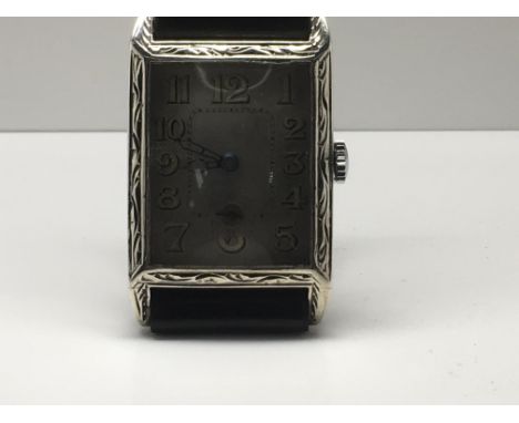 A silver case wristwatch the square dial with Arabic numerals manual wind