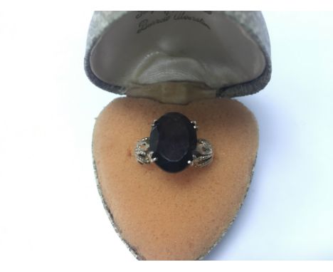 A 9ct gold ring set with a smokey quartz stone. Weight approx 3.71g, size approx M