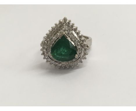 A 18 ct gold emerald and diamond white gold ring size O