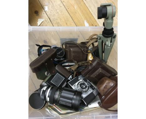 A box of various camera equipment including Zeiss Icon extending cameras, a Minolta SLR and Tamron lens