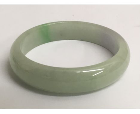 A light green jade bangle