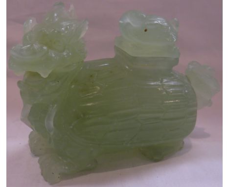 Chinese jade colour carved stone vessel figured as a Fo Dog, the lid on its back carved with a turtle, length 15cm, height 10