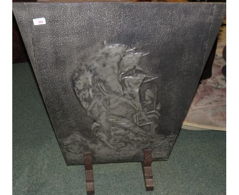Trapezoid shaped pewter clad fire screen, beaten and embossed with a ship (height 80cm width 71cm)