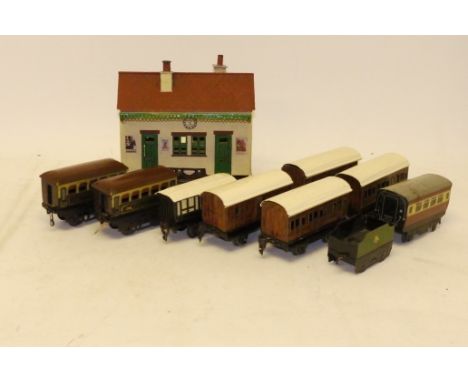 Assorted O Gauge Tinplate Coaching Stock and Station Building, including 4 Marklin GNR 'teak' 4-wheelers, a Carette LNWR ditt