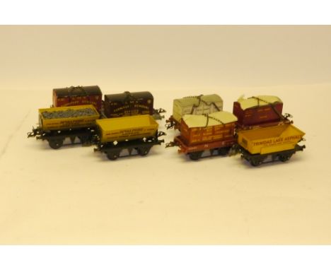 Hornby O Gauge Boxed Flat Side- and Rotary-Tipping Wagons, comprising LMS, NE and BR Flat trucks with various containers, one