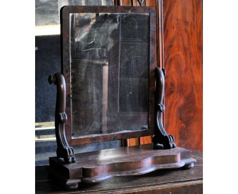 A 19th Century oblong swing Toilet Mirror in mahogany frame on serpentine fronted platform base. 