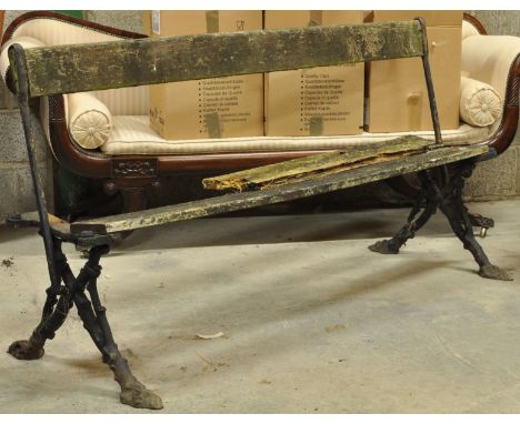 A Victorian cast iron and lathe Garden Bench. 5' 8" (173cms) wide. (a/f). 