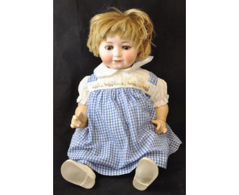 A William Goebel bisque head Doll, sleeping eyes and open mouth with four teeth, marked "W G B1-9, Germany", 18" (46cms) tall