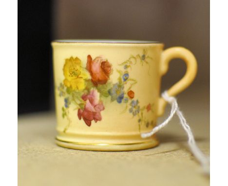 A Royal Worcester miniature Cup painted with sprays of flowers on a blush ivory ground, date code for 1912. 