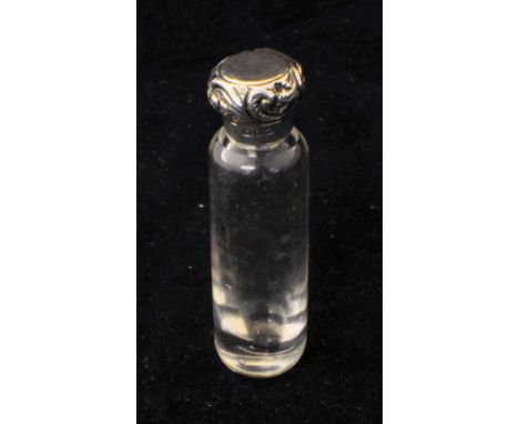 A late Victorian small glass Scent Flask with embossed silver cover. 