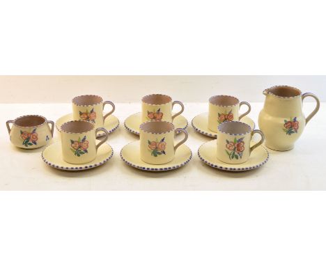A Carter Stabler Adams Poole Pottery Coffee Set decorated with stylised flowers, comprising six cups and saucers, milk jug an