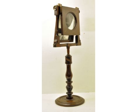 An early 19th century mahogany Zograscope with magnifying glass and mirror, inlaid with chequer banding, and on an adjustable