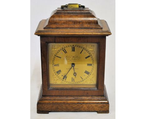 A Mantel Timepiece, the brass dial inscribed 'John Walker, London' with French movement in mahogany caddy top case. 8" (20cms