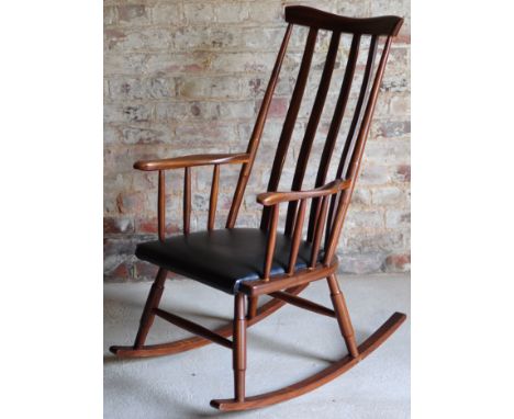 An Ercol type rail back Rocking Elbow Chair. 