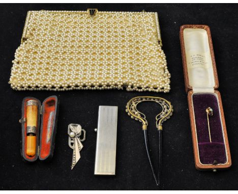 A 9ct. gold seed pearl Stick Pin in case, an amber cheroot holder (a/f), retractable comb, beadwork purse etc. 