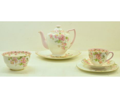 A Royal Doulton Sheila pattern Teaset decorated with floral sprays, comprising 12 cups and saucers, 12 plates, teapot, milk j