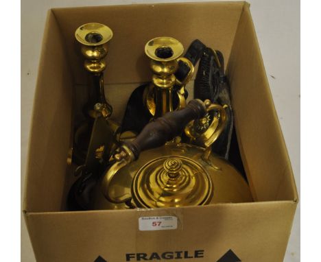 A pair of Victorian brass Candlesticks with push up ejectors, 9 1/2" (22cms) high, two short leather straps hung with brasses