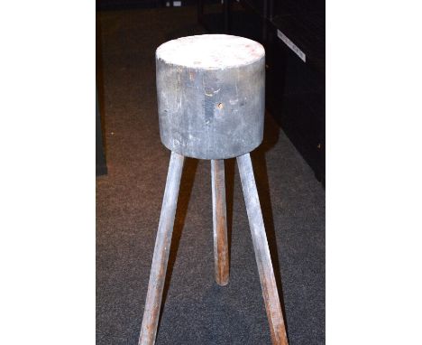 A painted butchers block, of circular form, raised on tripod supports, 92cm high