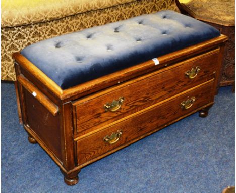 A converted oak stool, with stuffover velour top above two graduated drawers, raised on squat feet