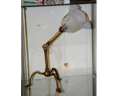 An Arts & Crafts adjustable table lamp, in the manner of William Arthur Smith Benson, with white frosted glass shade raised o