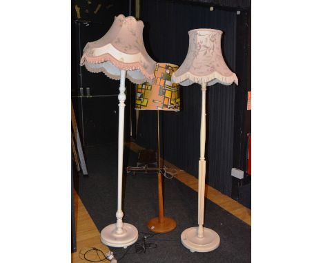 Two painted floor lamps with shades, 192cm high, together with a retro floor lamp with shade (3)