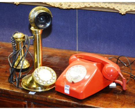 A red bakelite telephone, together with a stick telephone (2) CONDITION REPORT: Lot 214 - Good condition, minor scuffs and sc