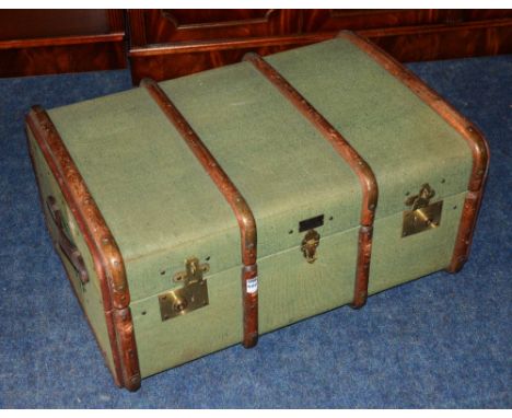 A vintage wood bound and canvas travel trunk, enclosing fitted interior, with carry handles, 35cm high x 78cm wide