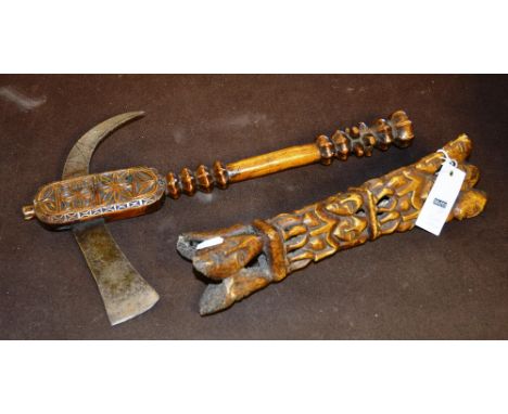 A Sarawak axe and carved bone with figures and masks (2)