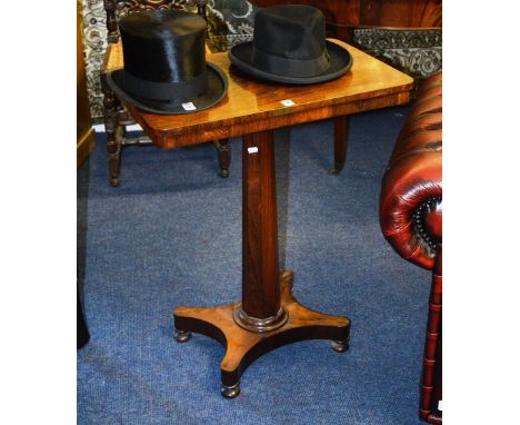 A William IV rosewood tea table, with rounded top above tapering faceted column support and platform base, 74cm high x 61cm w