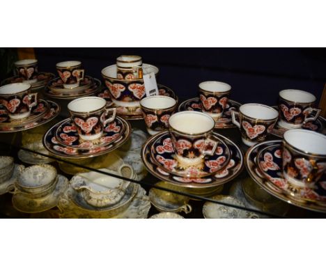 A Wileman & Co Foley China Imari pattern teaset, comprising of two biscuit plates, cream and sugar, 12 side plates, 11 saucer